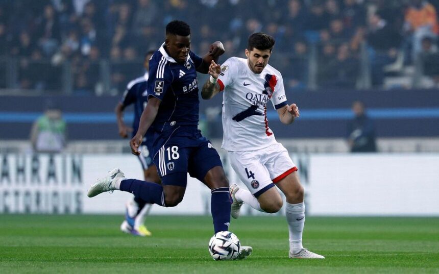 Marshall Munetsi, seen here battling with Balerdi during the derby, is not expected to return to Paris FC despite his successful loan spell. AFP/Kenzo TRIBOUILLARD